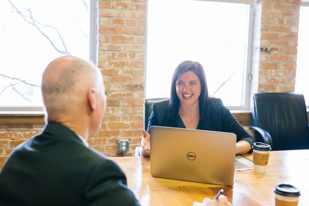 menopause support in scotland a confident women talking at a business meeting
