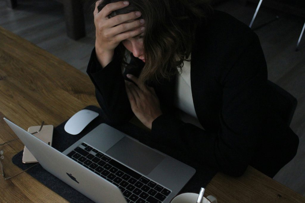 womens support in scotland a woman looking stressed at her job